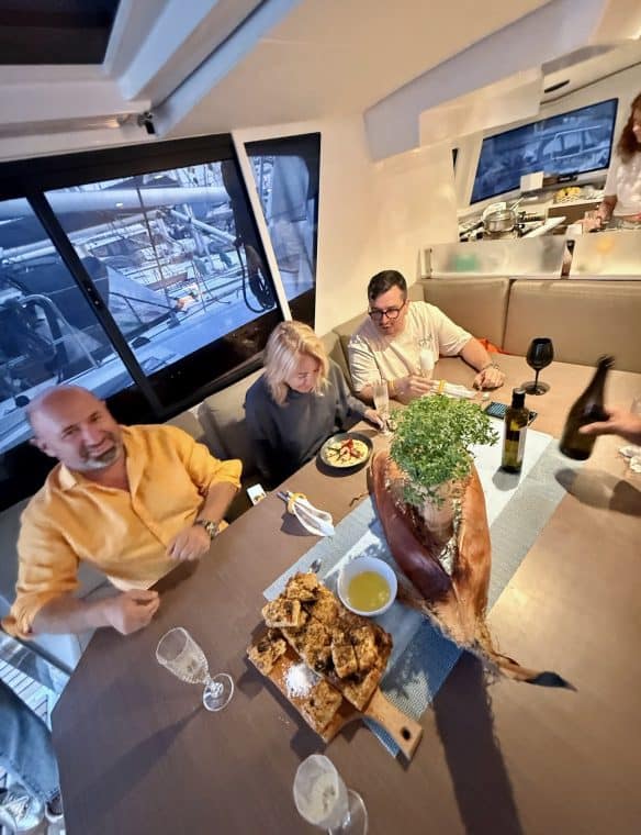 Enjoying a cosy dinner with friends at Pikasea, a renowned restaurant known for its exceptional seafood and harbour views. Perfect for memorable dining experiences in a maritime setting.