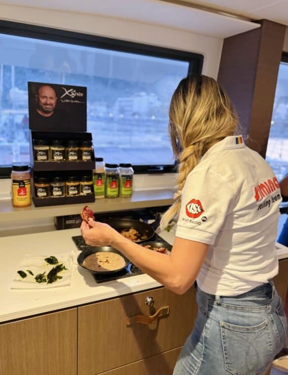 Spice expert cooking with Pikasea spices at home, featuring various spices and fresh herbs on the kitchen counter, showcasing culinary creativity with quality seasoning products.